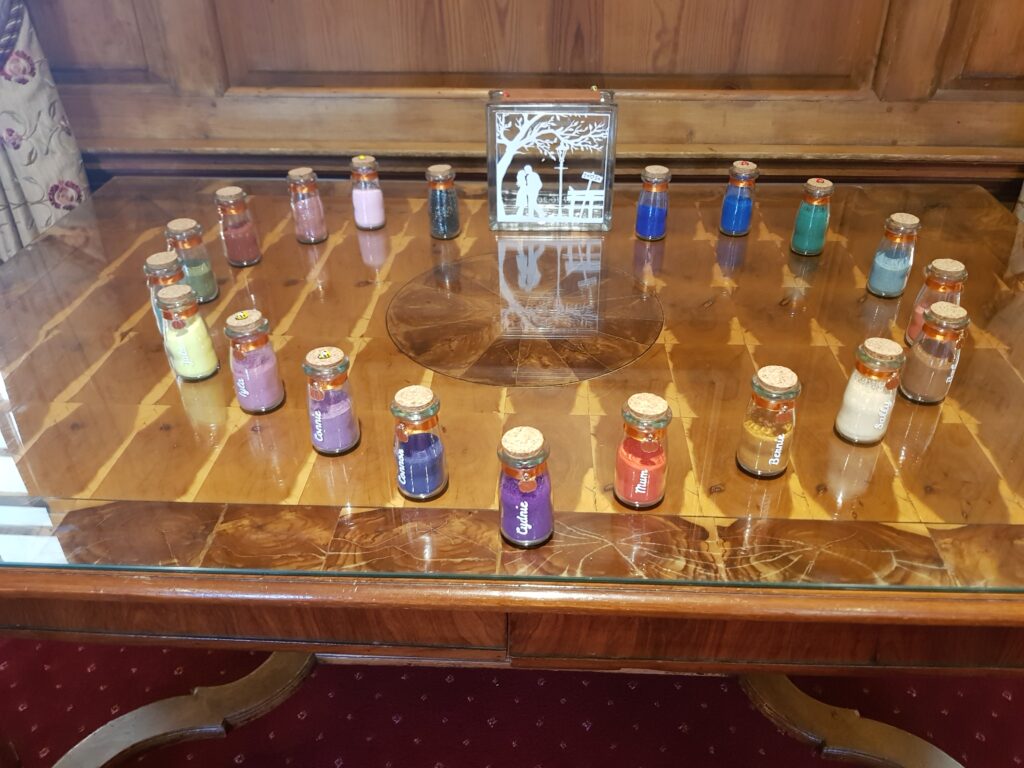 Vessel and jars od colourful sand for a Sand Blending Ceremony