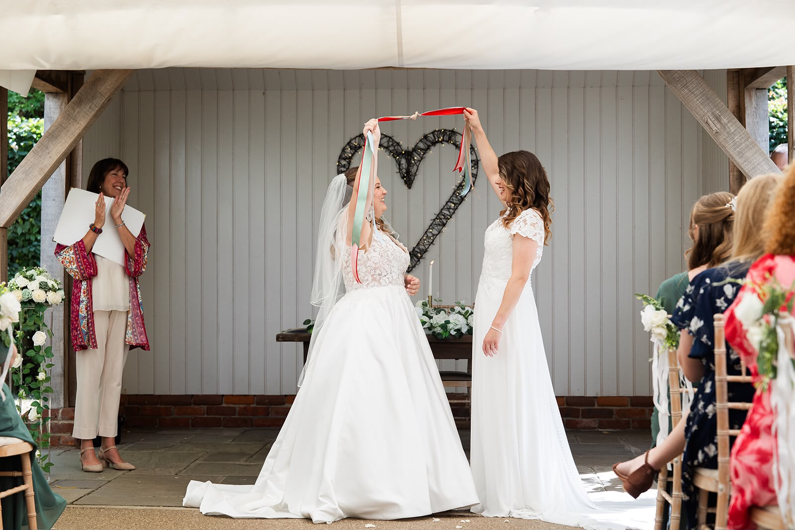 Bride and bride tie the knot in their wedding ceremony